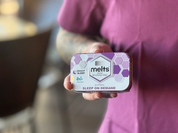 Hand Holding Melts Tin